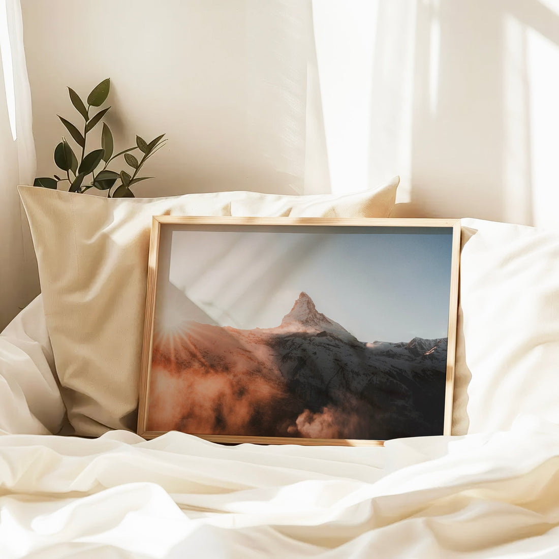 Scenic Zermatt sunset photography print showcasing the Matterhorn surrounded by glowing clouds.