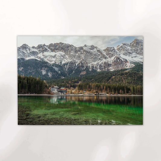 Snow-covered Zugspitze mountain towering above Eibsee in early spring