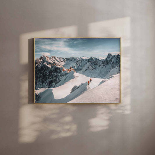 Framed wall art print of two mountaineers walking along the Aiguille du Midi arete with stunning alpine scenery.