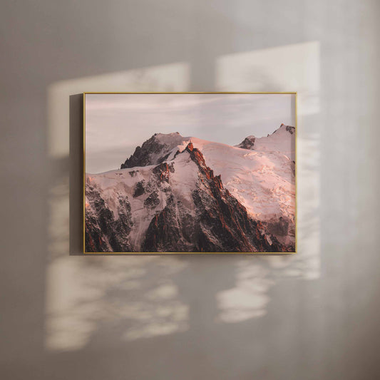 Chamonix wall art featuring the Aiguille du Midi glowing in the evening sun, framed with natural shadows.