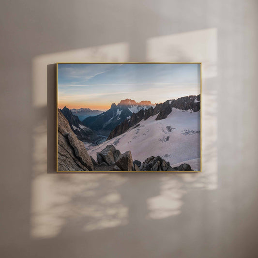 Sunset view of Mer de Glace glacier in Chamonix, framed wall art with a golden hue.