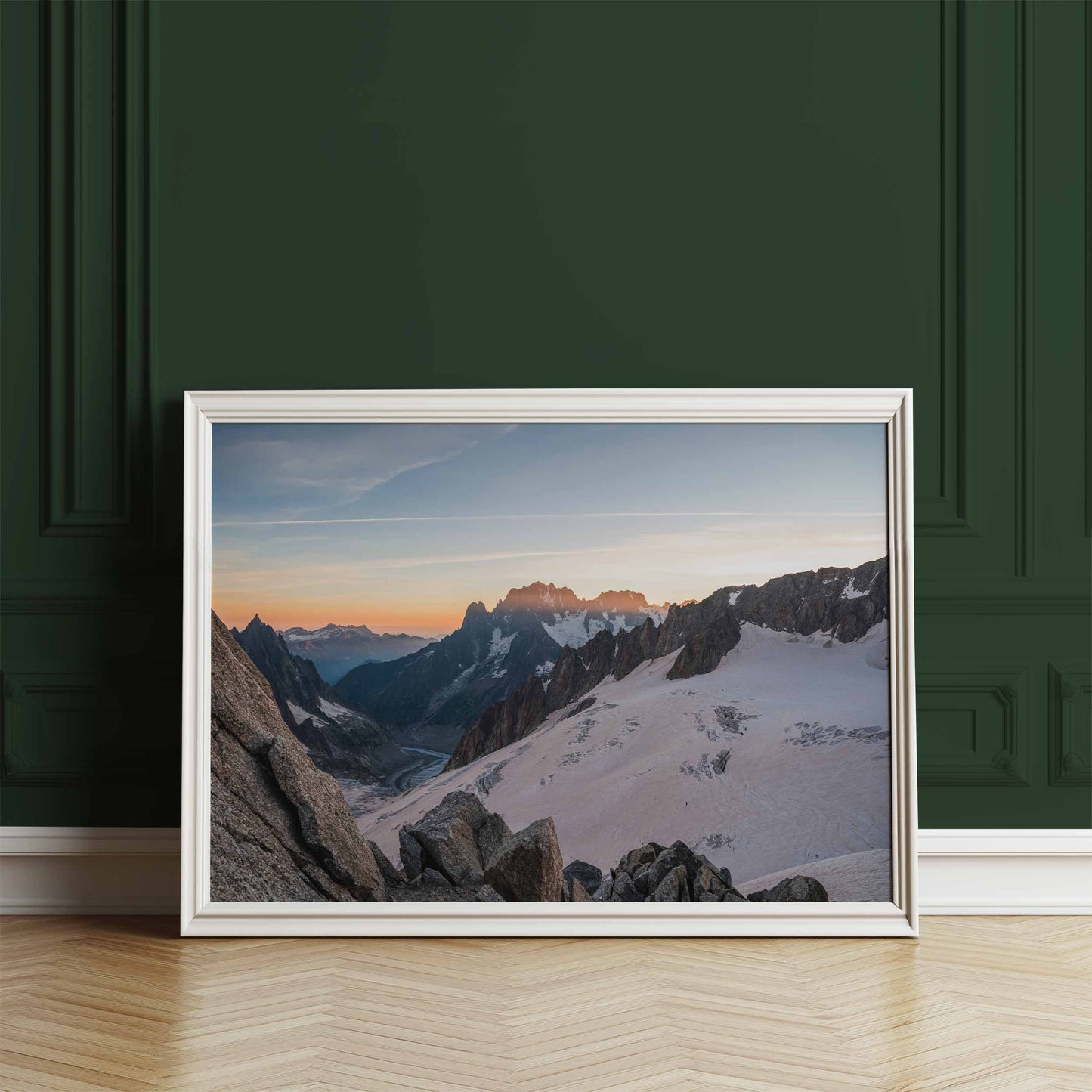 Mer de Glace glacier sunset print framed and leaning against a green wall.