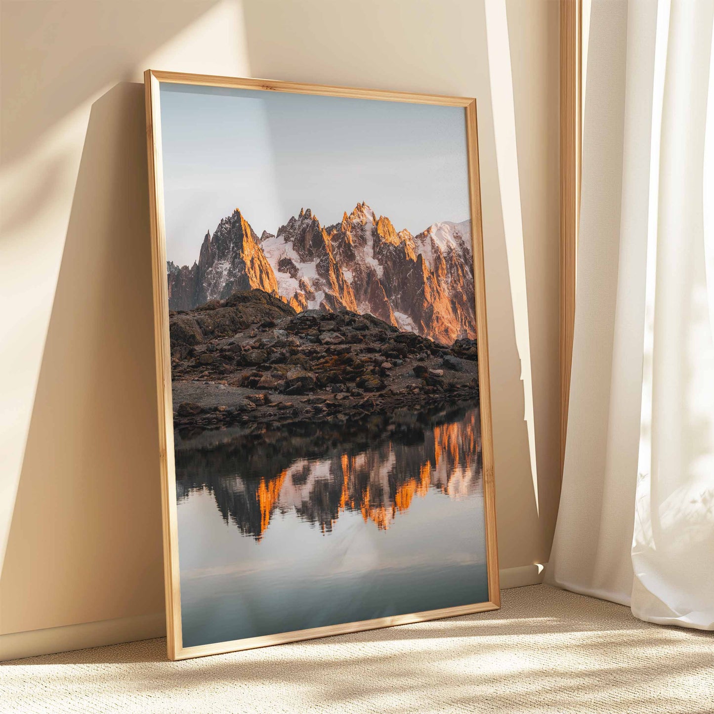 Iconic Lac Blanc sunrise in Chamonix with mountain reflections, elegantly showcased in a classic wooden frame.