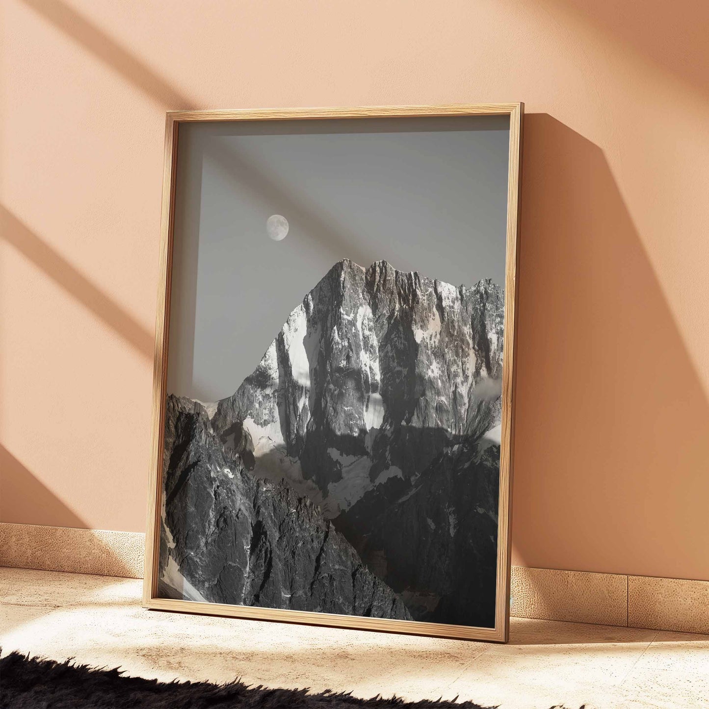 Natural wood frame holding a Grand Jorasses moonlit monochrome photography print.