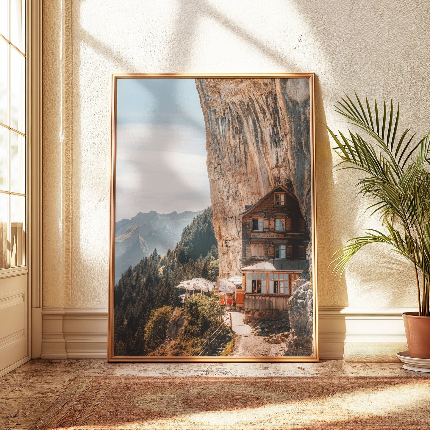 The Aescher Guesthouse, bathed in warm light, framed in light gold and surrounded by breathtaking Swiss Alps scenery.