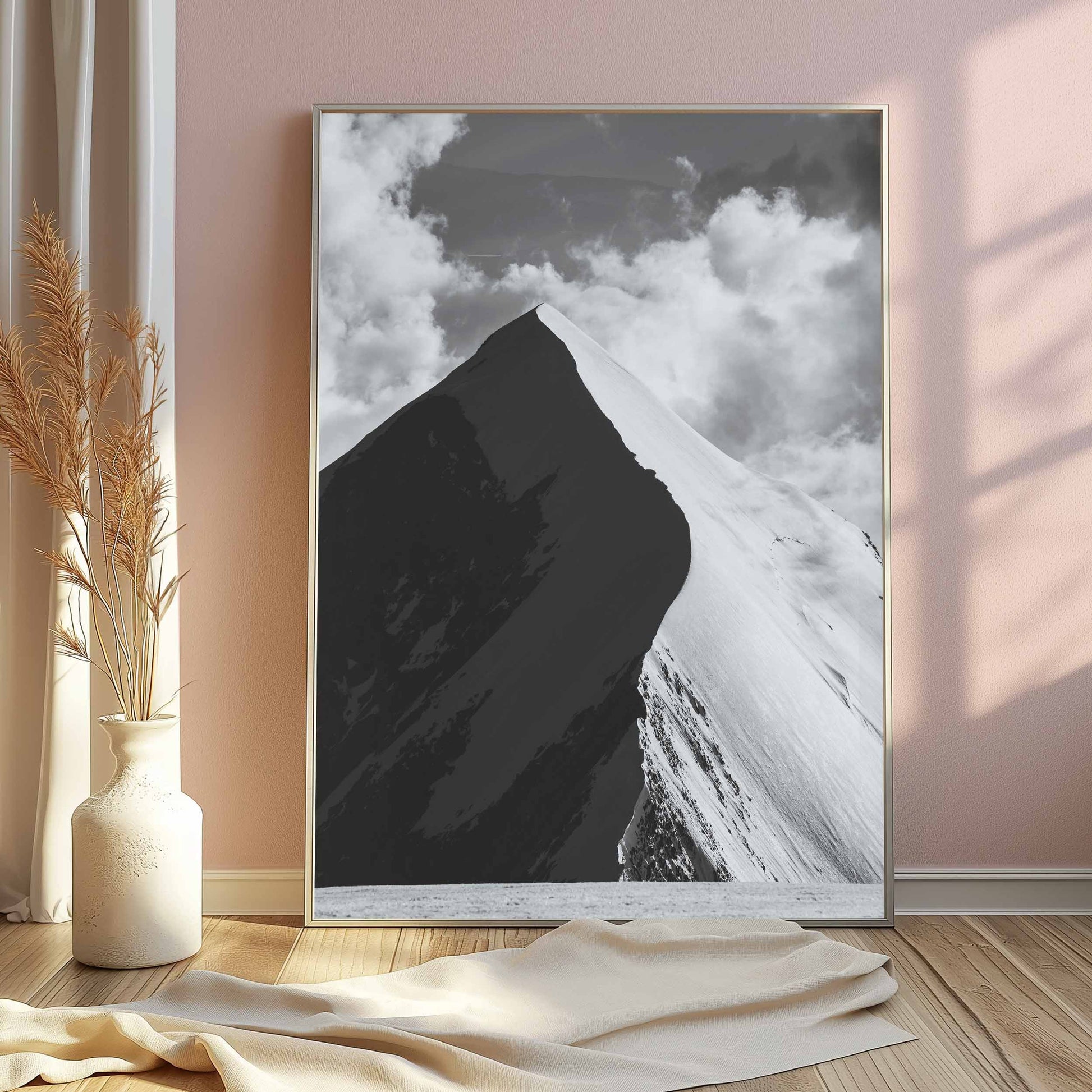 Monochrome image of the soaring Aiguille de Bionnassay ridge with dynamic lighting and dramatic alpine clouds