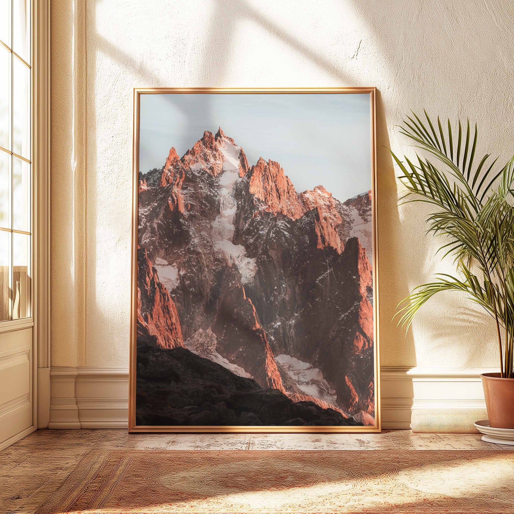 Alpine grandeur of Aiguille de Chamonix captured in vivid evening hues, displayed in a warm and inviting interior.