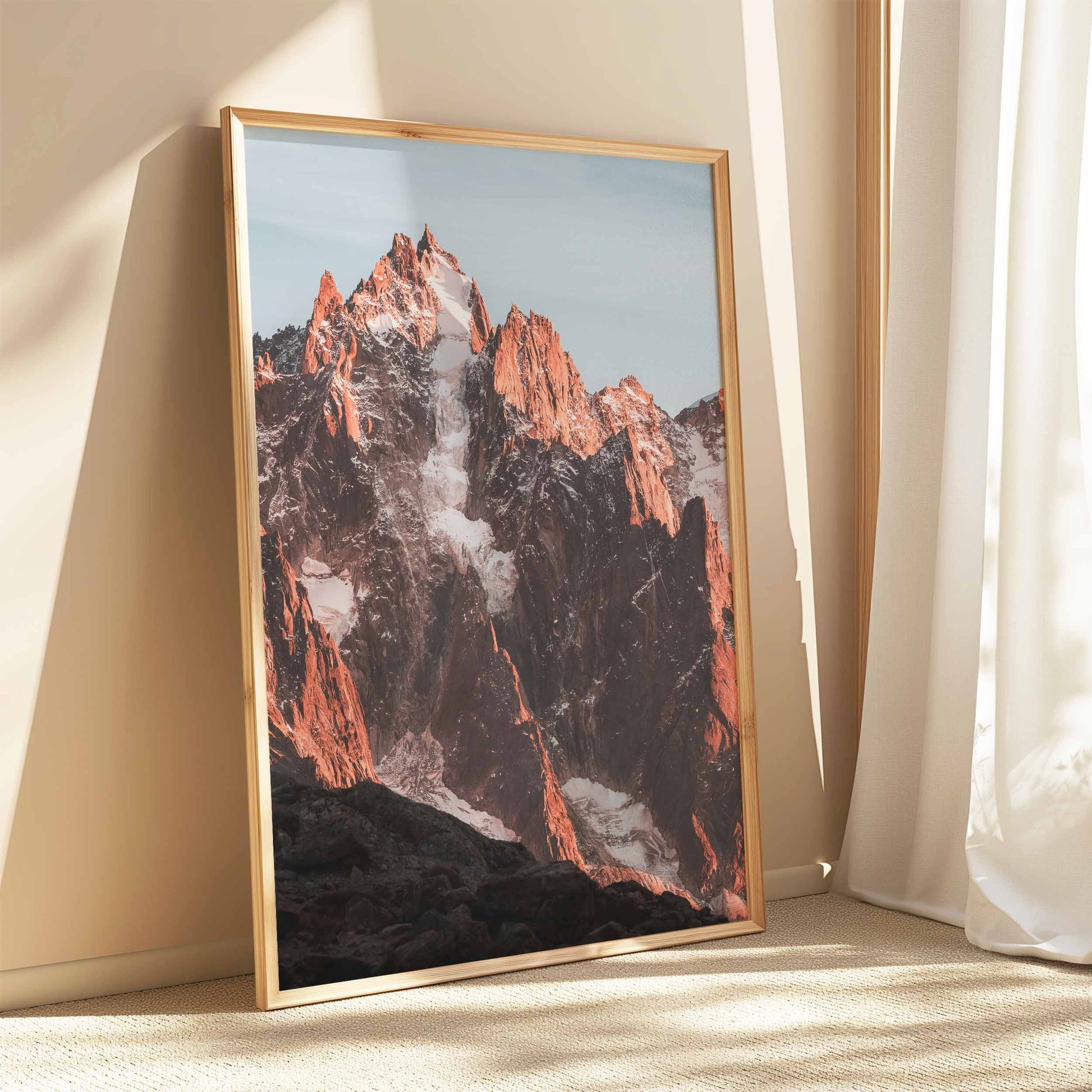 Aiguille de Chamonix framed in wood, emphasizing its natural beauty against a minimalist backdrop.