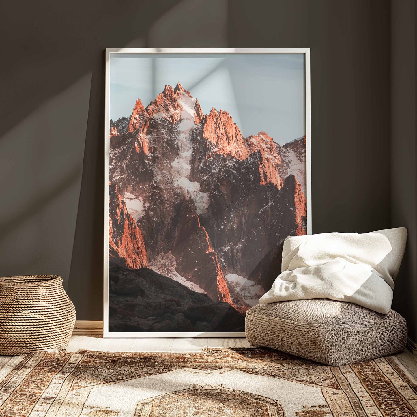 Captivating view of Aiguille de Chamonix at sunset, framed elegantly in a cozy modern living space.