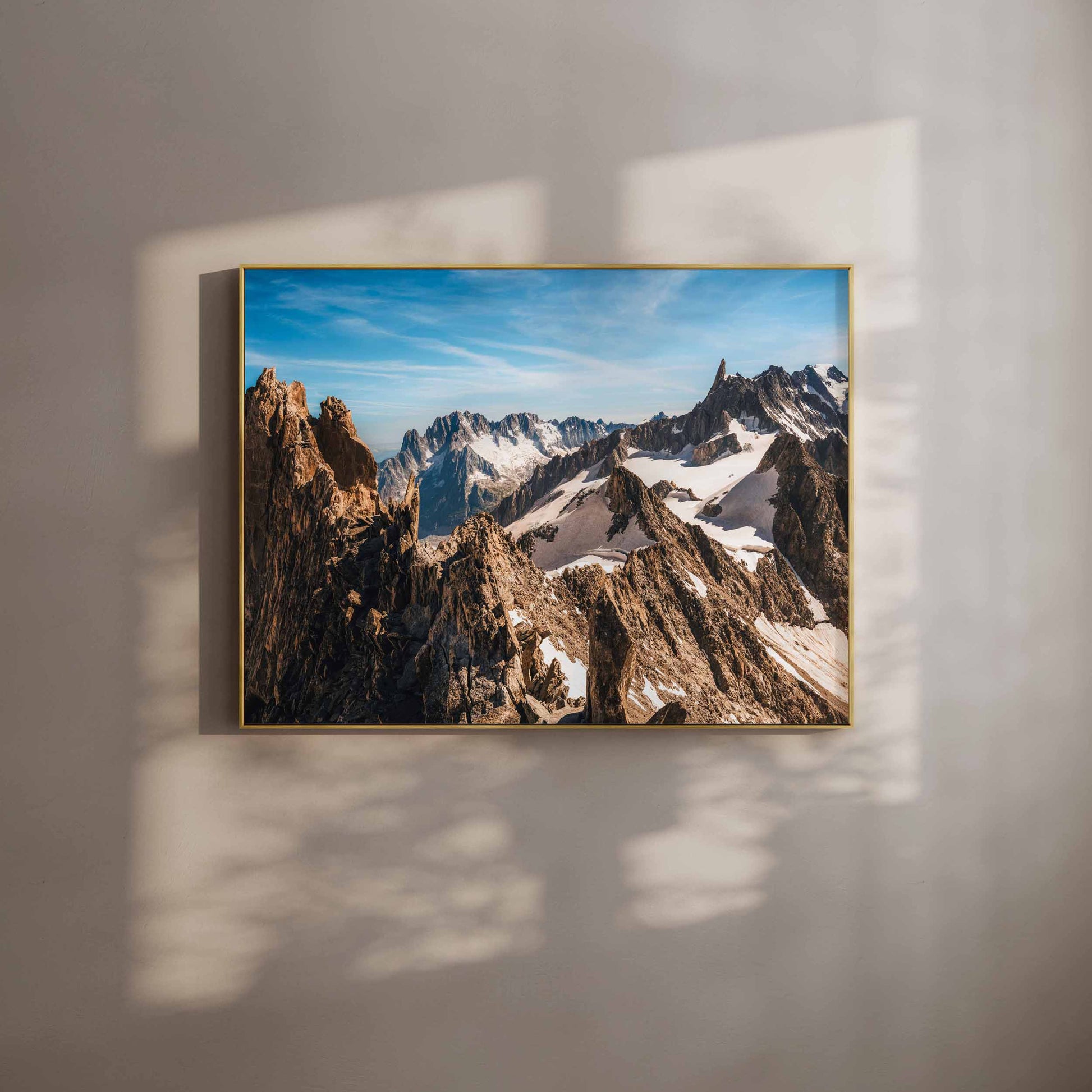 Wall art print of Aiguille d'Entrèves mountain range, with clear blue skies, showcasing rugged alpine beauty, framed in gold