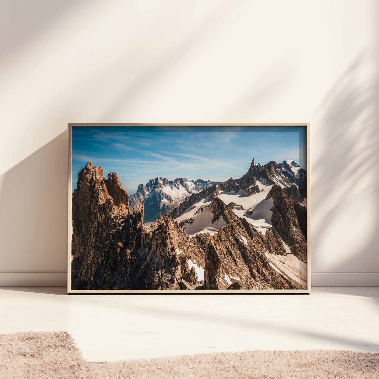 Landscape photo print of Aiguille d'Entrèves' rugged peaks, beautifully framed in light wood, perfect for modern interiors.