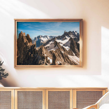 Stylish wall art showcasing the majestic Aiguille d'Entrèves mountain range, with a wooden frame against natural lighting.