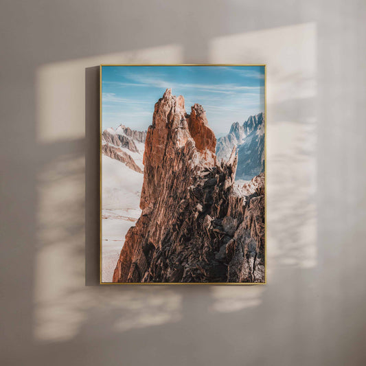 Aiguille d'Entrèves traverse captured in golden sunlight, showcasing rugged alpine rock formations and snowy peaks. Perfect Chamonix wall art for mountain lovers.