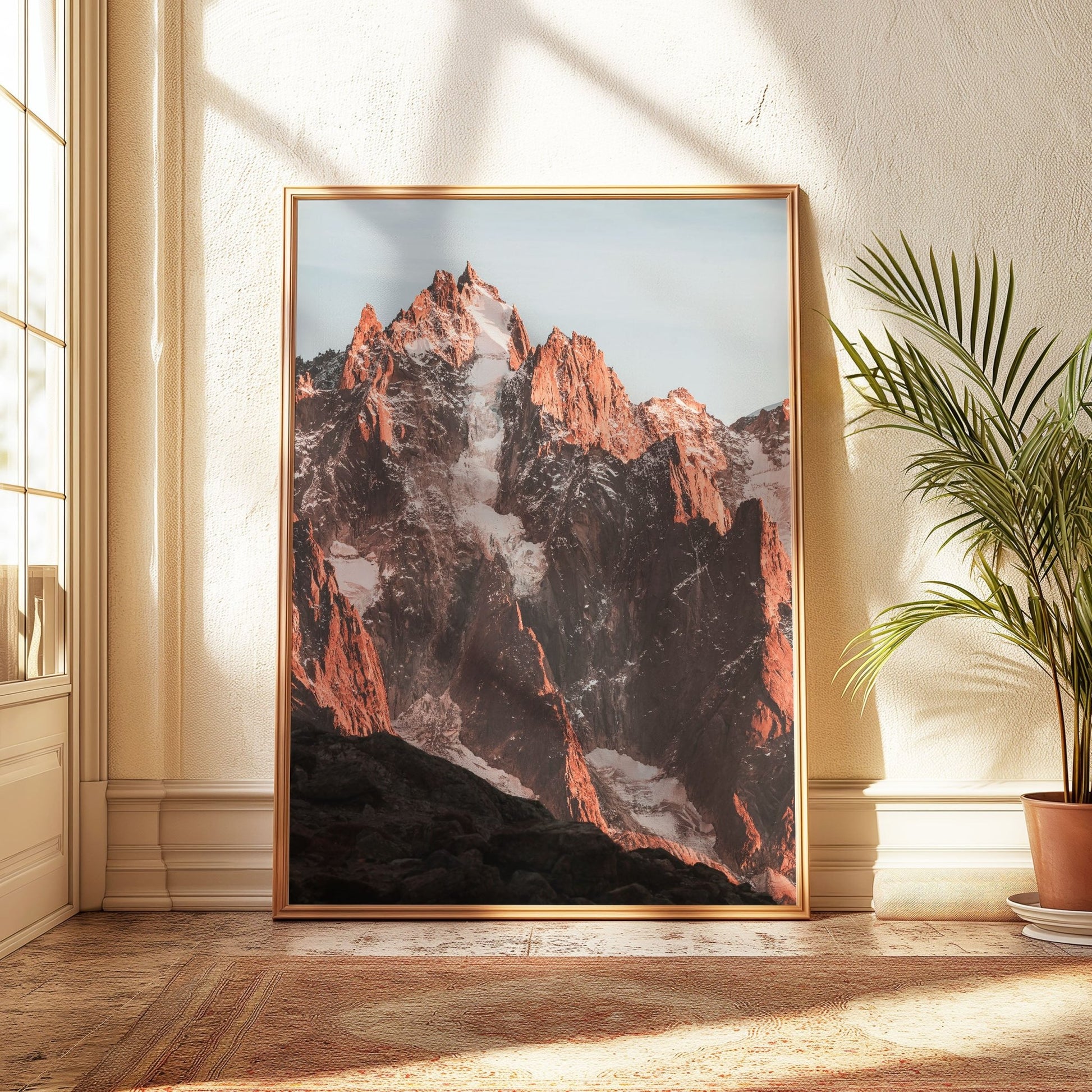 Framed photograph of Aiguille du Chamonix glowing orange at sunset, with dramatic alpine views.