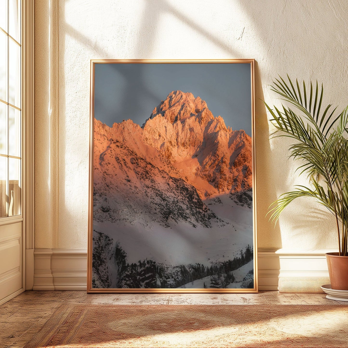 Golden Hour view of Aiguille du Chardonnet, its majestic peak glowing in warm sunlight against a snowy alpine backdrop.