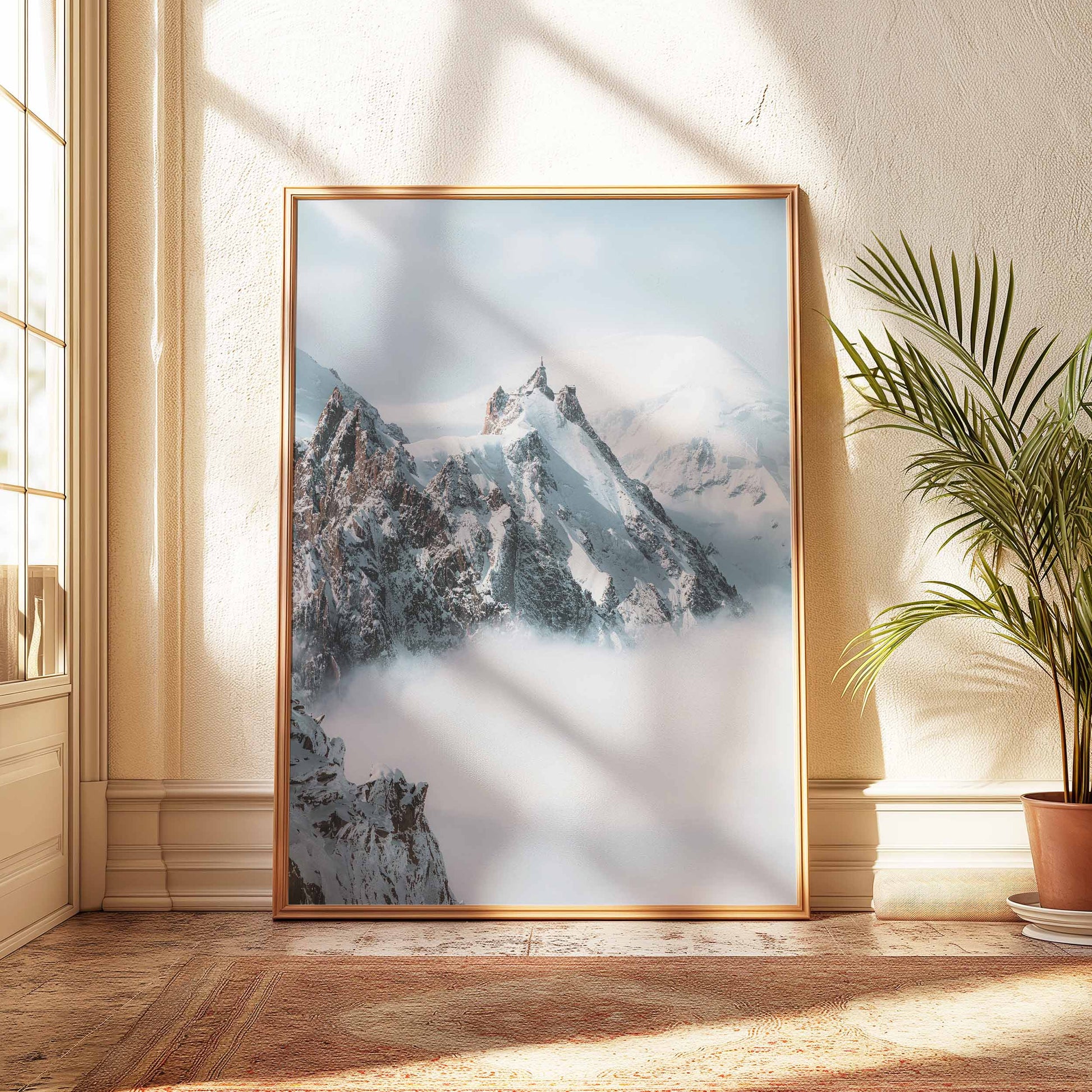 Winter landscape of Aiguille du Midi with clouds and dramatic peaks.