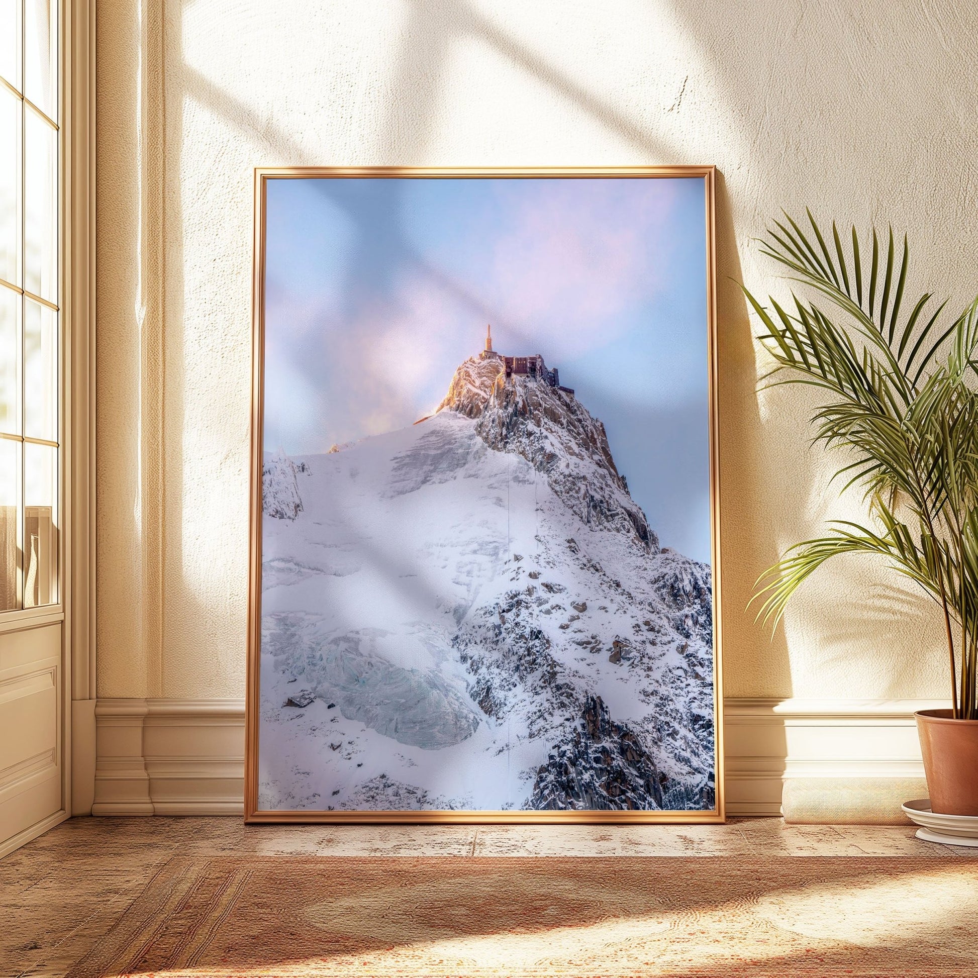 Soft pink hues on Aiguille du Midi summit, a snowy masterpiece in Chamonix.