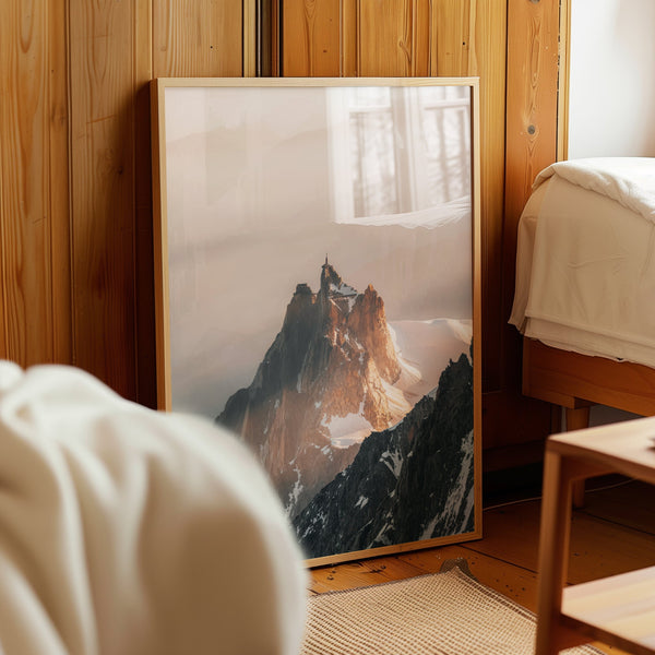Striking summit photography of Aiguille du Midi with misty mountain peaks and snow-covered ridges.