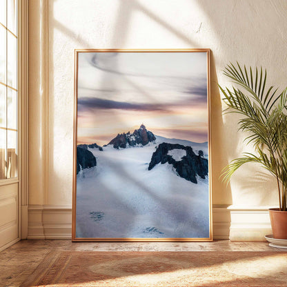 Alpine sunset art print featuring the Aiguille du Midi in a warm room setting with a wooden frame.