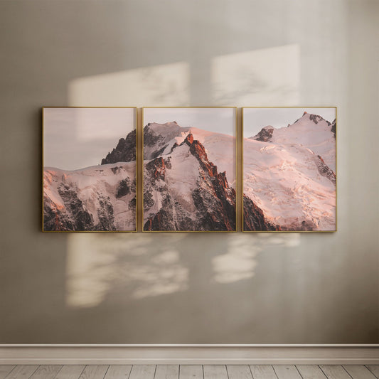 Sunlit Aiguille du Midi triptych displayed on a beige wall with gold frames.