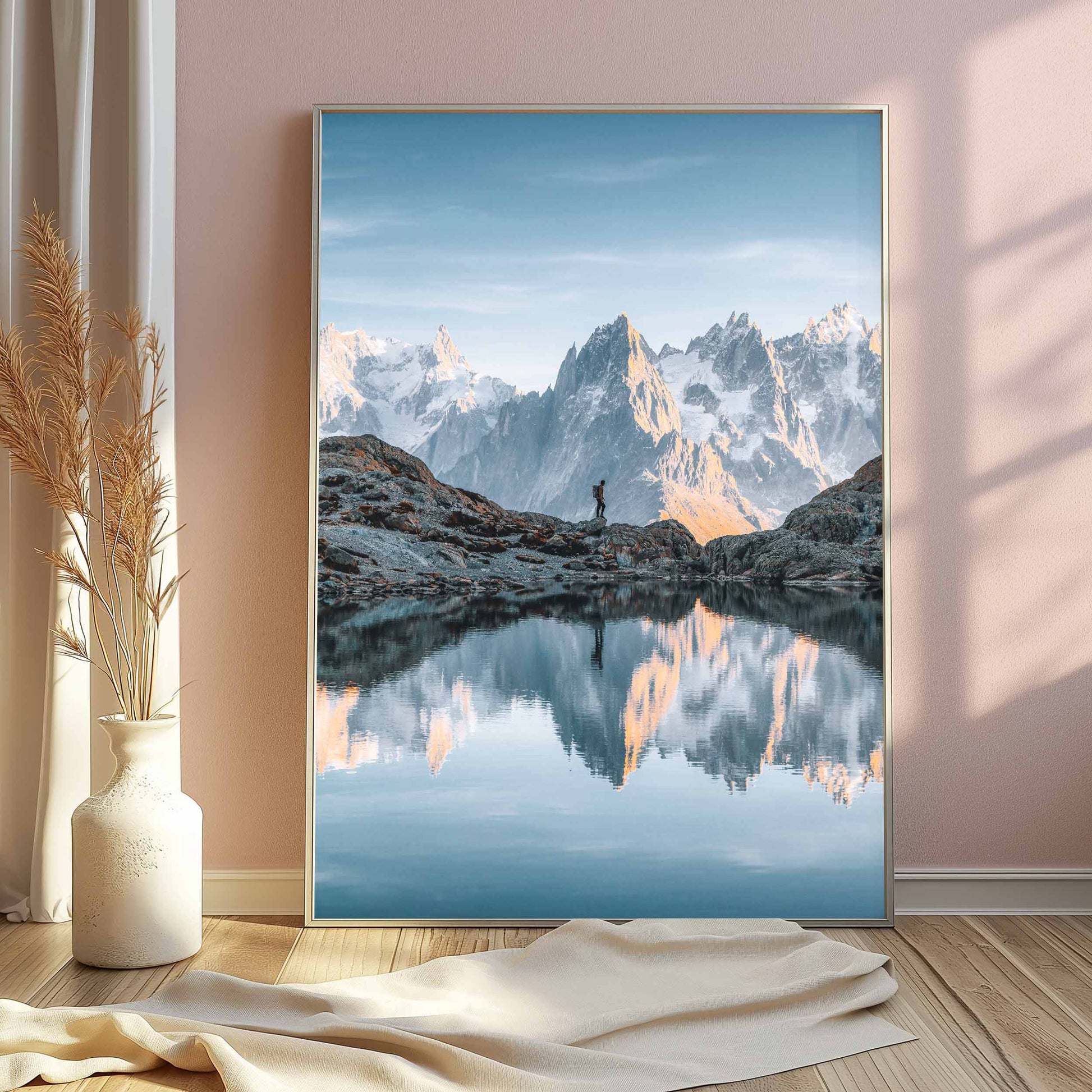 A serene Lac Blanc view with the Aiguilles de Chamonix standing tall in the background, reflected in the water during sunset.