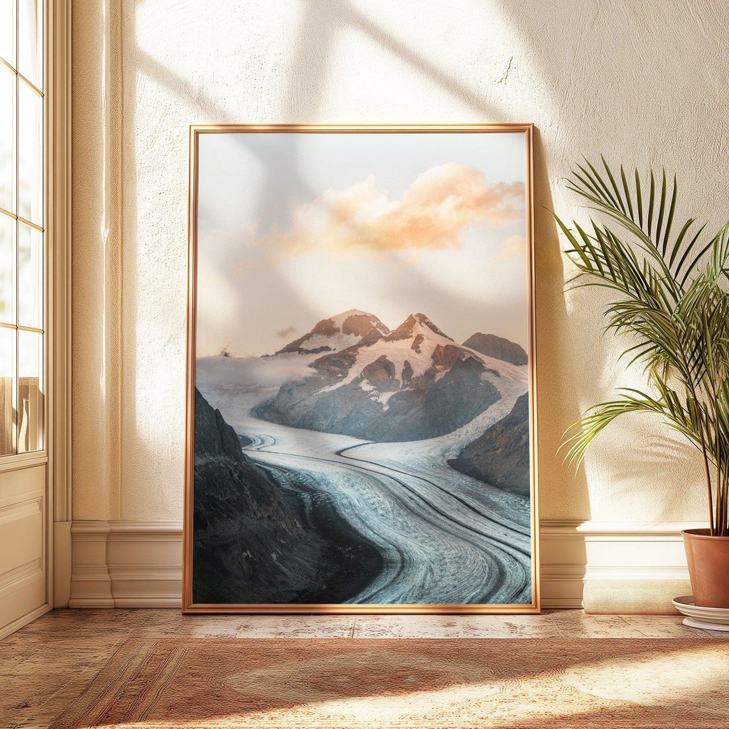 Sunset over Aletsch Glacier with soft pink and orange clouds, framed in gold.