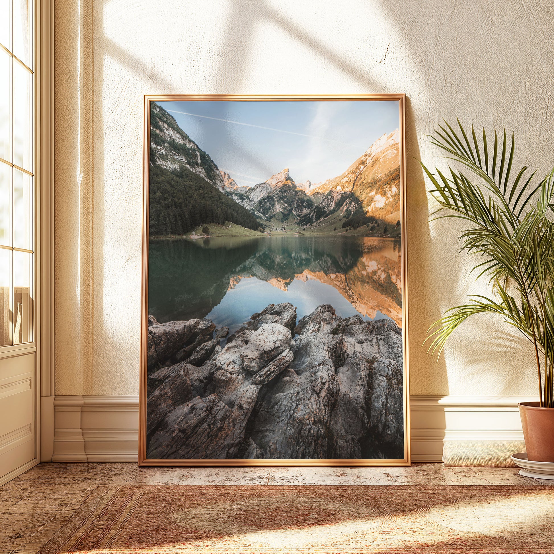 Alpine lake Seealpsee with rocky foreground and serene mountain reflections in the Swiss Alps, a perfect nature-inspired wall print.