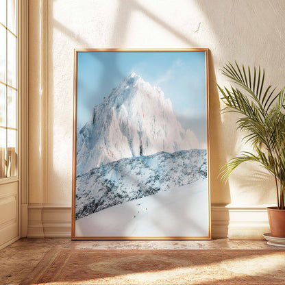 Clear puddle reflecting the Aiguille de Chamonix amidst a rocky alpine path at sunrise