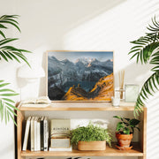 Alpine sunset wall decor with warm light illuminating grassy ridges above Oeschinensee’s tranquil waters.