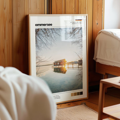 Framed Ammersee Bavaria Germany boathouse landscape print in natural wood frame leaning against pine panelled bedroom wall