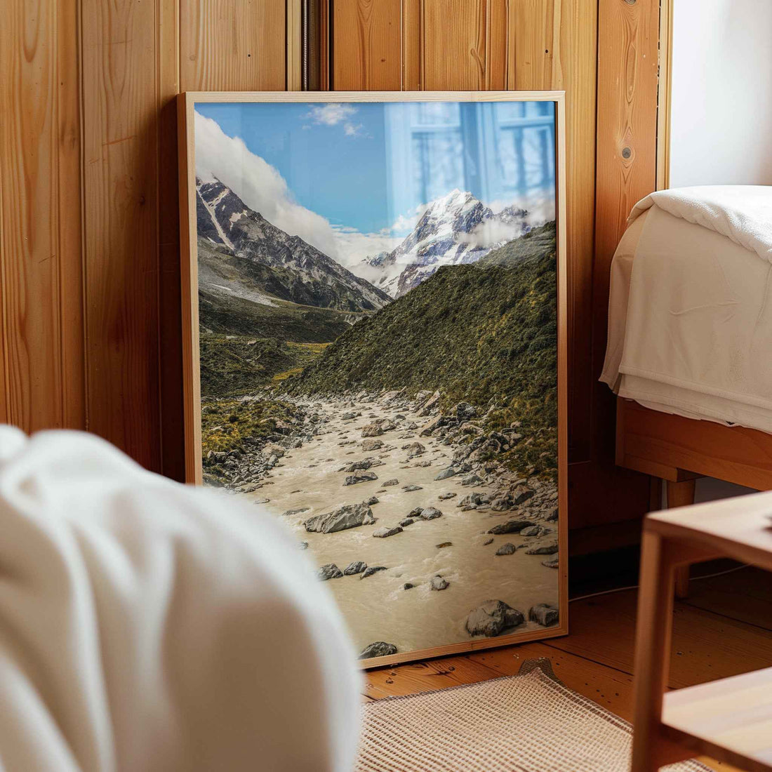 Natural wood framed Aoraki Mount Cook Hooker Valley New Zealand print leaning against a wooden bedroom wall