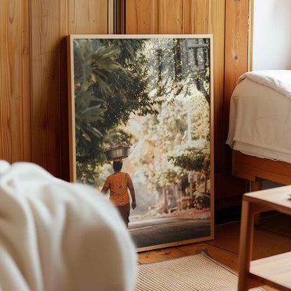 Balinese woman carrying offerings framed photography print leaning against wooden wall in cosy bedroom interior