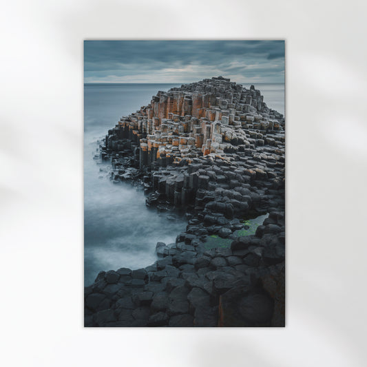 Basalt rock formations at the Giant's Causeway photographed in moody coastal light