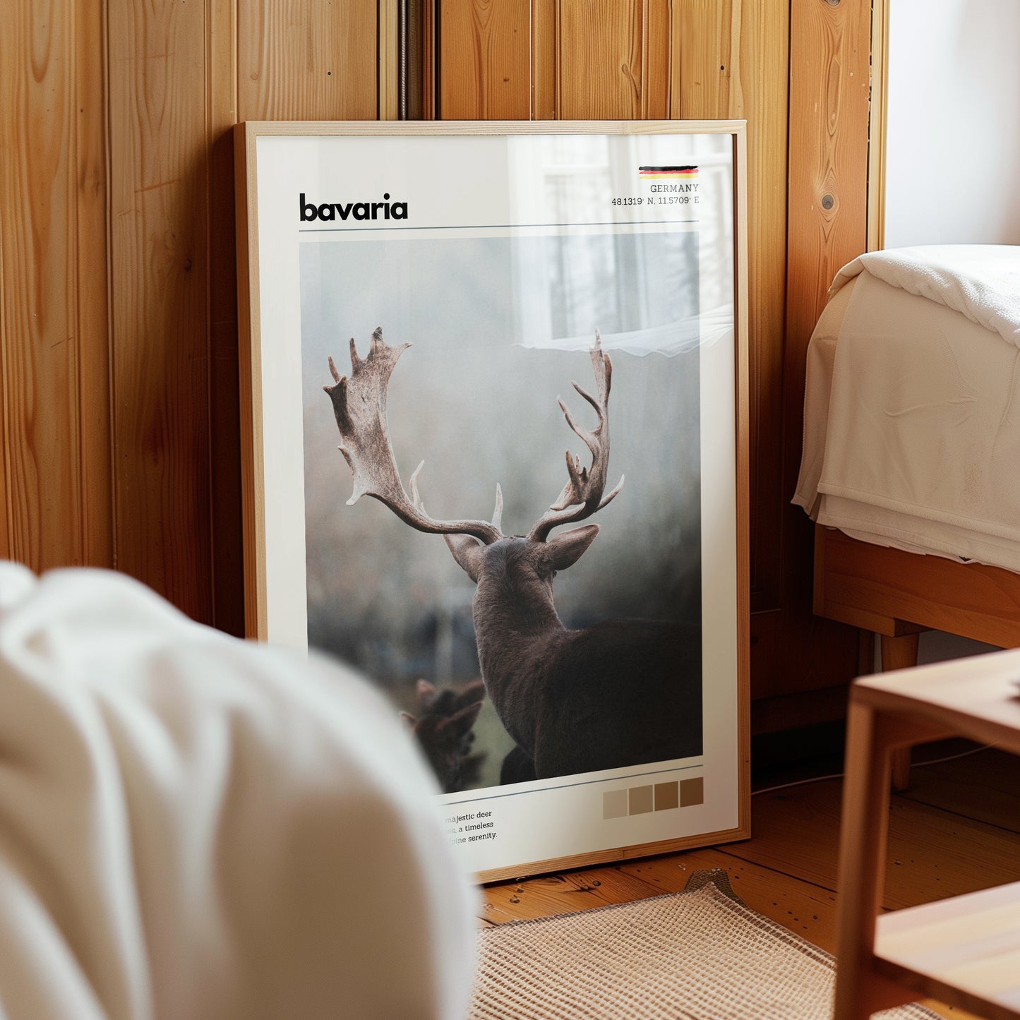 Framed Bavaria red deer stag Germany wildlife print in natural wood frame leaning against pine panelled bedroom wall