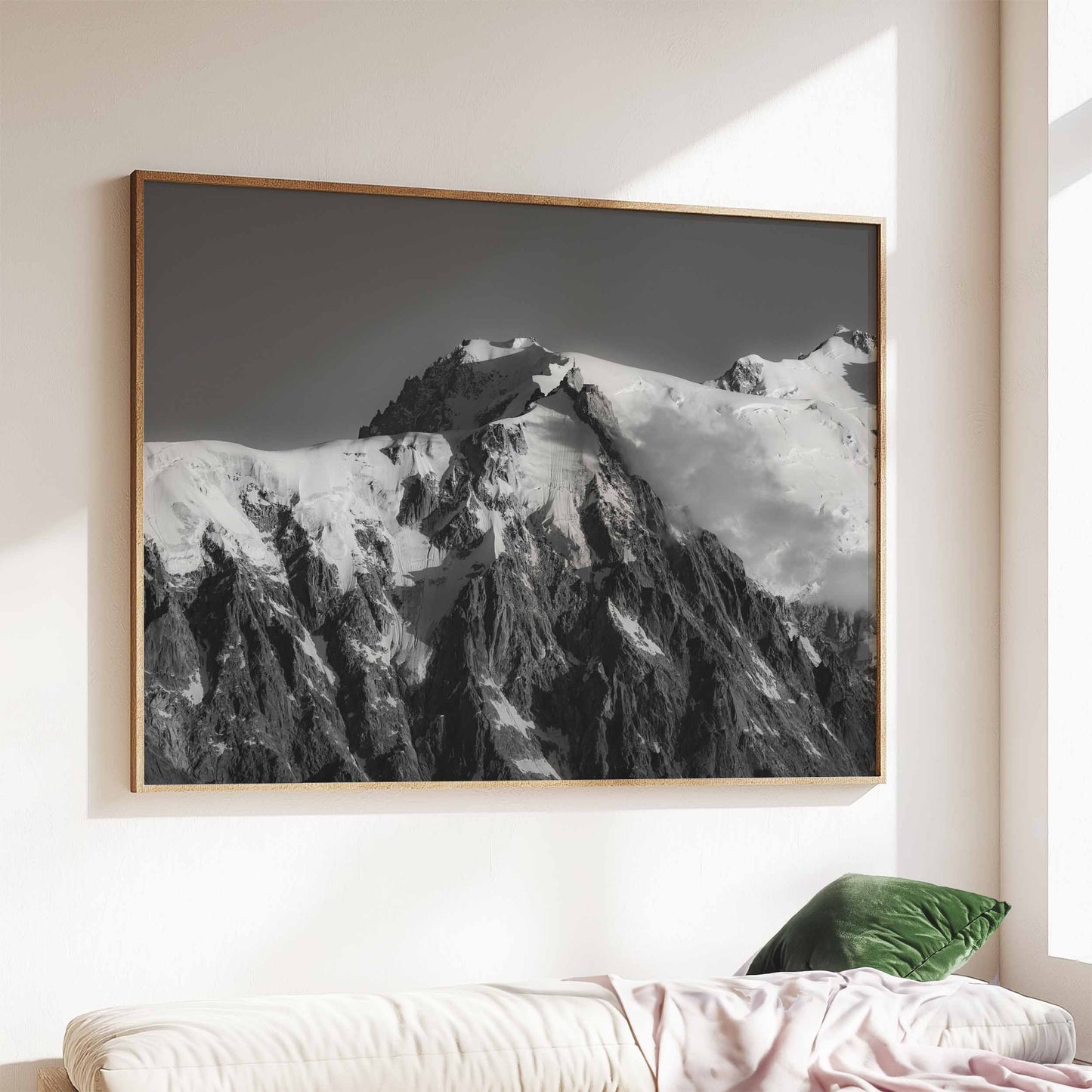 Aiguille du Midi in Chamonix, black and white wall art print in a wood frame on a bright wall.