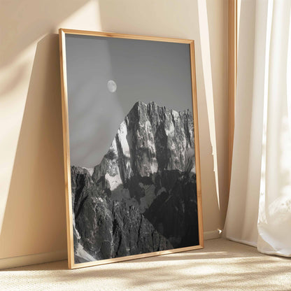 Black ash frame showcasing Grand Jorasses under a full moon in monochrome art.