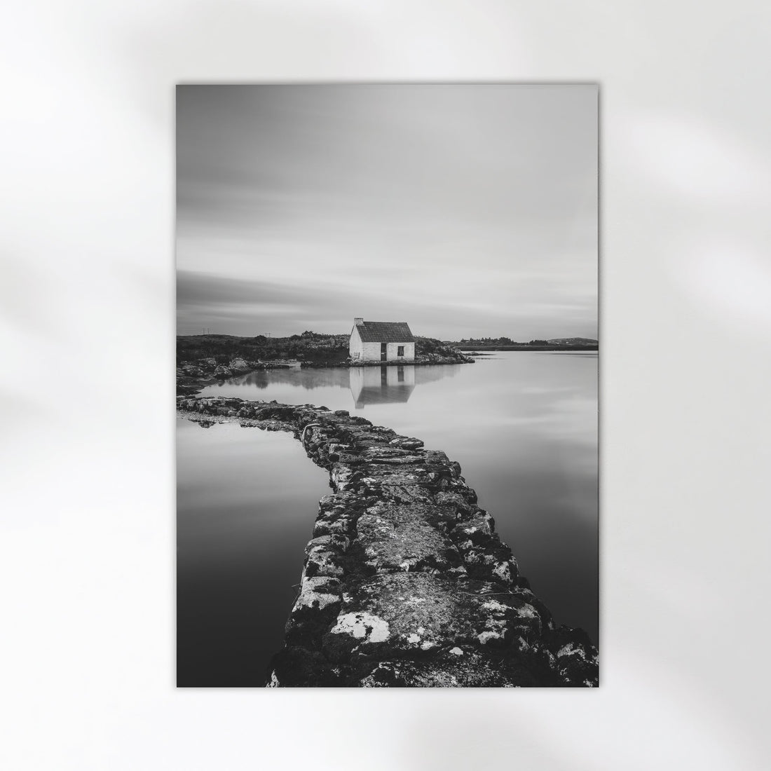 Fine art wall print of an Irish bothy by the water, in monochrome.