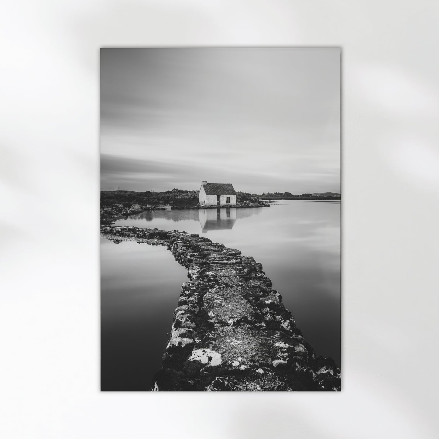 Fine art wall print of an Irish bothy by the water, in monochrome.