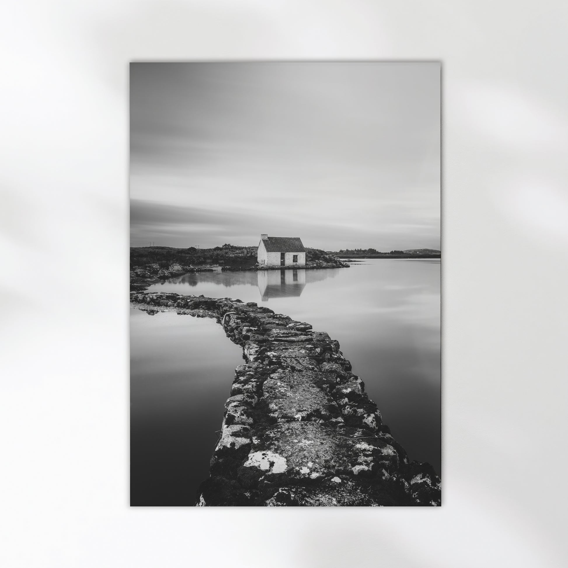 Fine art wall print of an Irish bothy by the water, in monochrome.