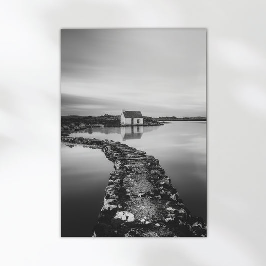 Fine art wall print of an Irish bothy by the water, in monochrome.