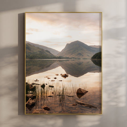 Framed fine art print of Buttermere in the Lake District at sunset with mountain reflections.