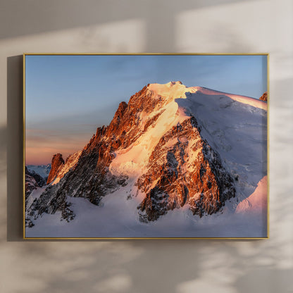 Unframed wall art print of Mont Blanc du Tacul glowing gold at sunrise, rocky ridge in view