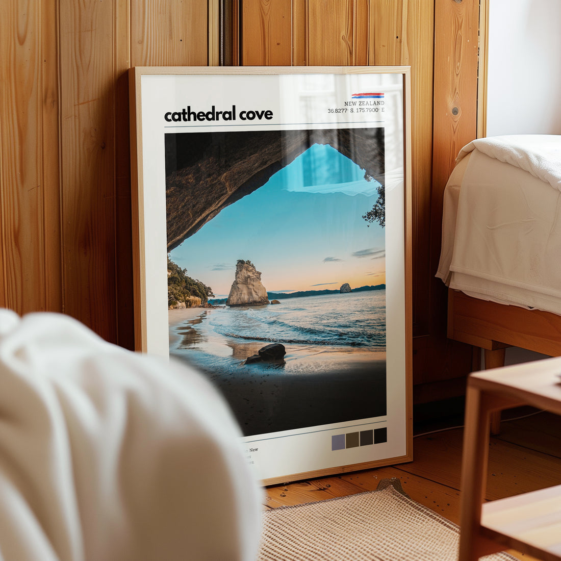 Cathedral Cove wall art print displayed in a calm bedroom interior with natural light