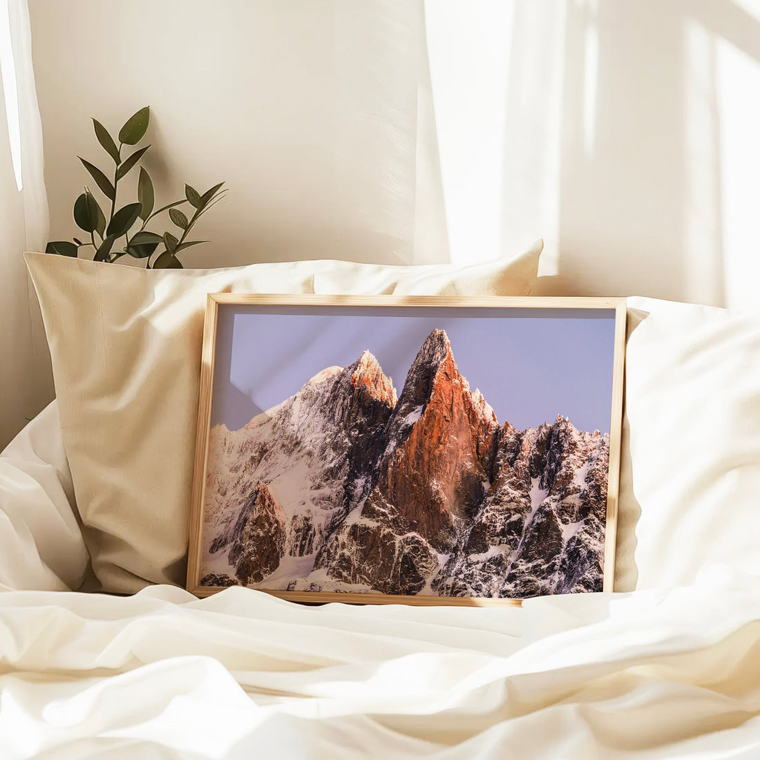 Minimalist wall decor featuring the sharp granite spires of Les Drus at golden hour in the heart of the French Alps.