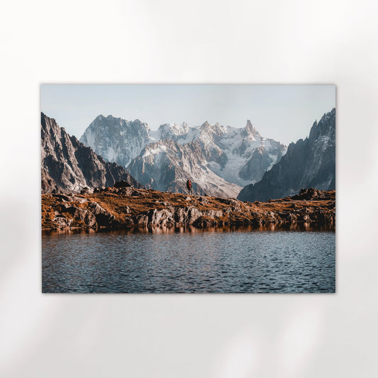 Chamonix hiking wall art featuring a solitary trekker and panoramic view of Mont Blanc Massif.