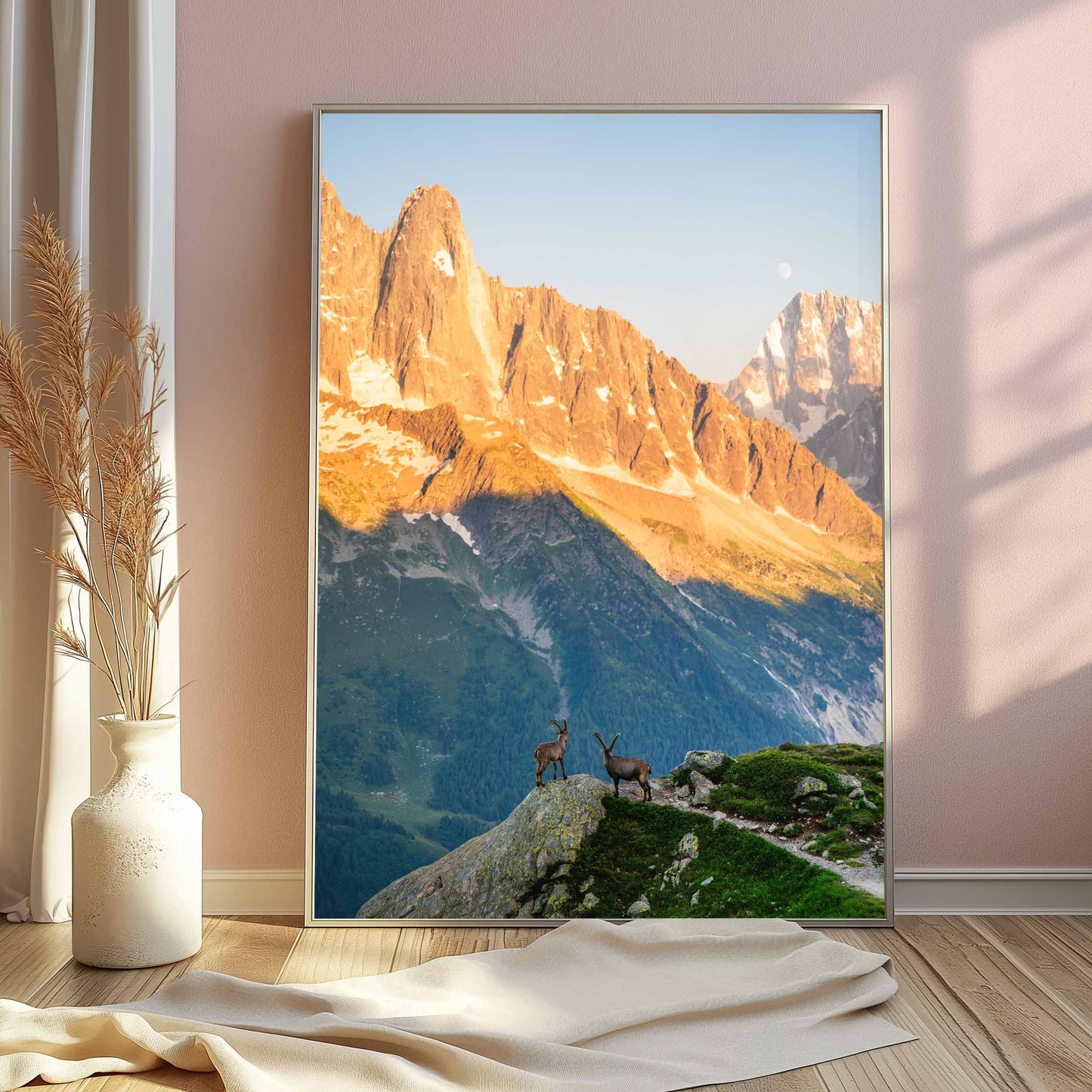 Ready-to-hang Chamonix ibex print in a premium black frame, showcasing golden-hour mountain views