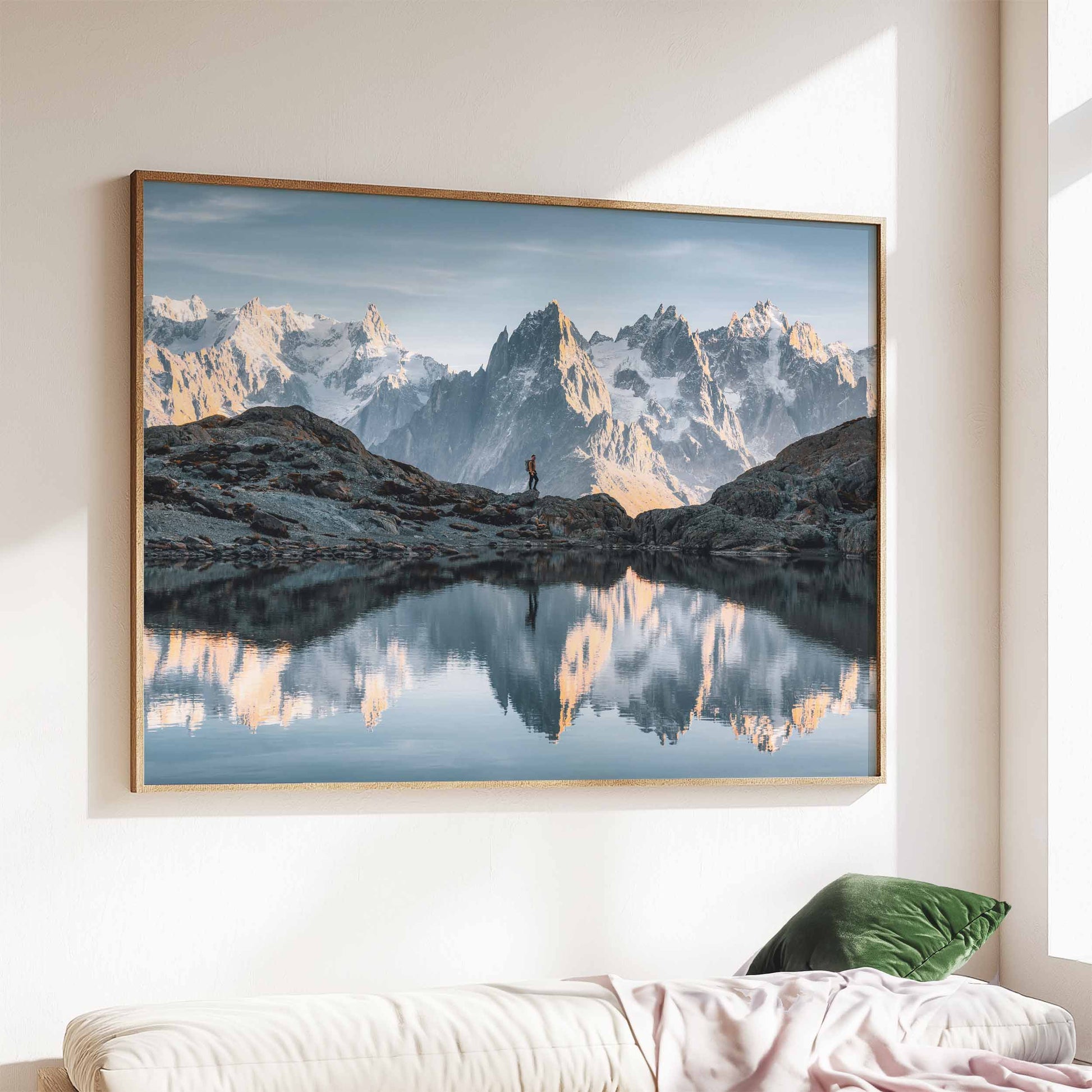 hamonix Lac Blanc wall art print in a modern wooden frame, styled above a cozy sofa with soft textures.