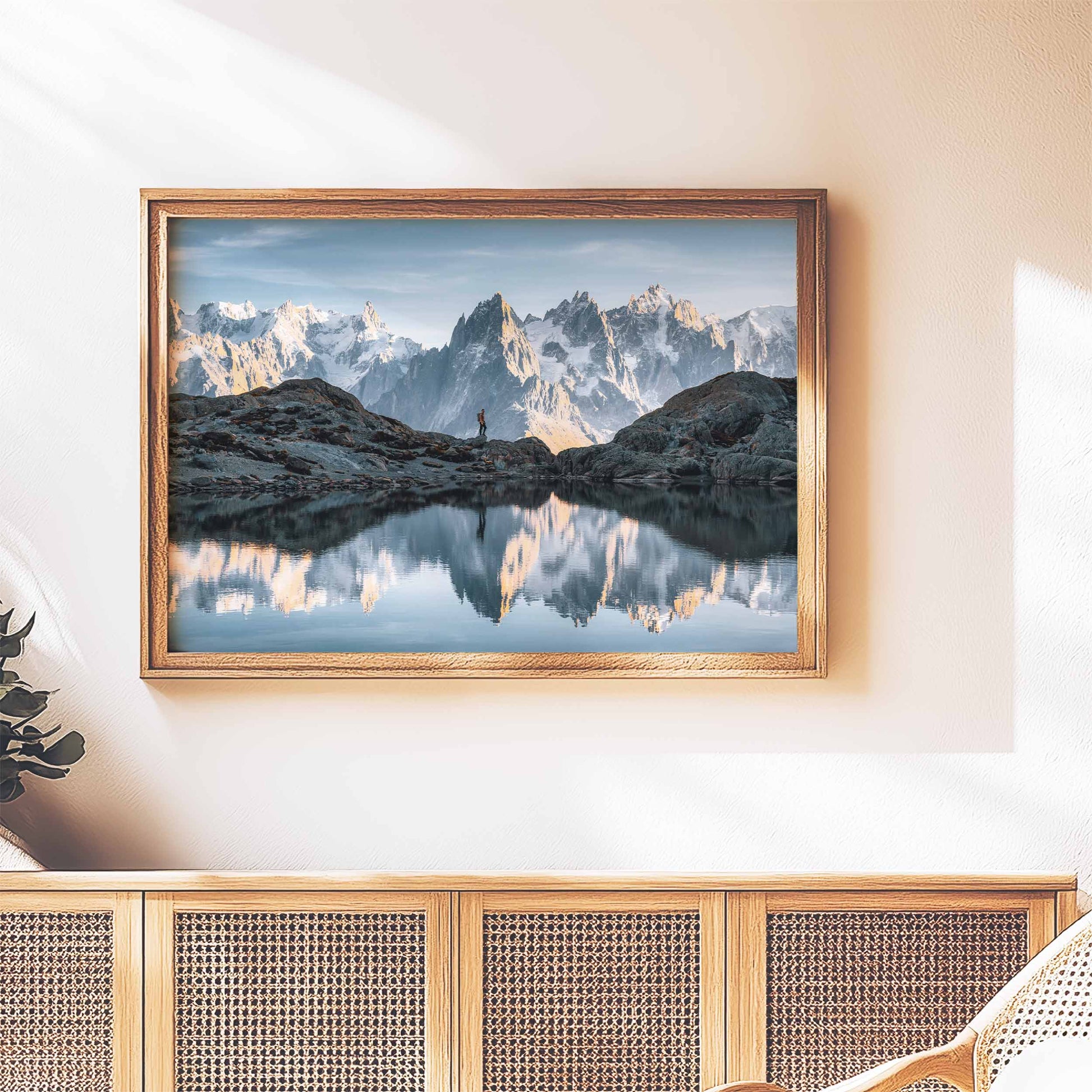 Wall art print of Lac Blanc in Chamonix, framed and mounted on a textured wood backdrop in a sunny space.