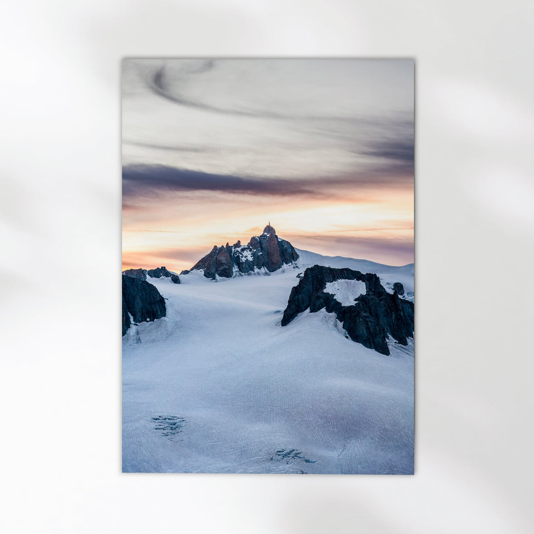 Chamonix mountain photography capturing the magical evening glow on Aiguille du Midi’s rugged summit.