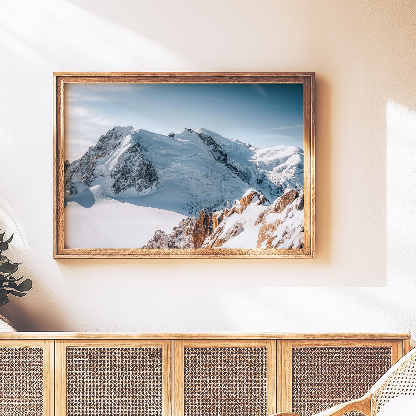 Minimalist room featuring framed art of the Cosmiques Arête and Mont Blanc massif